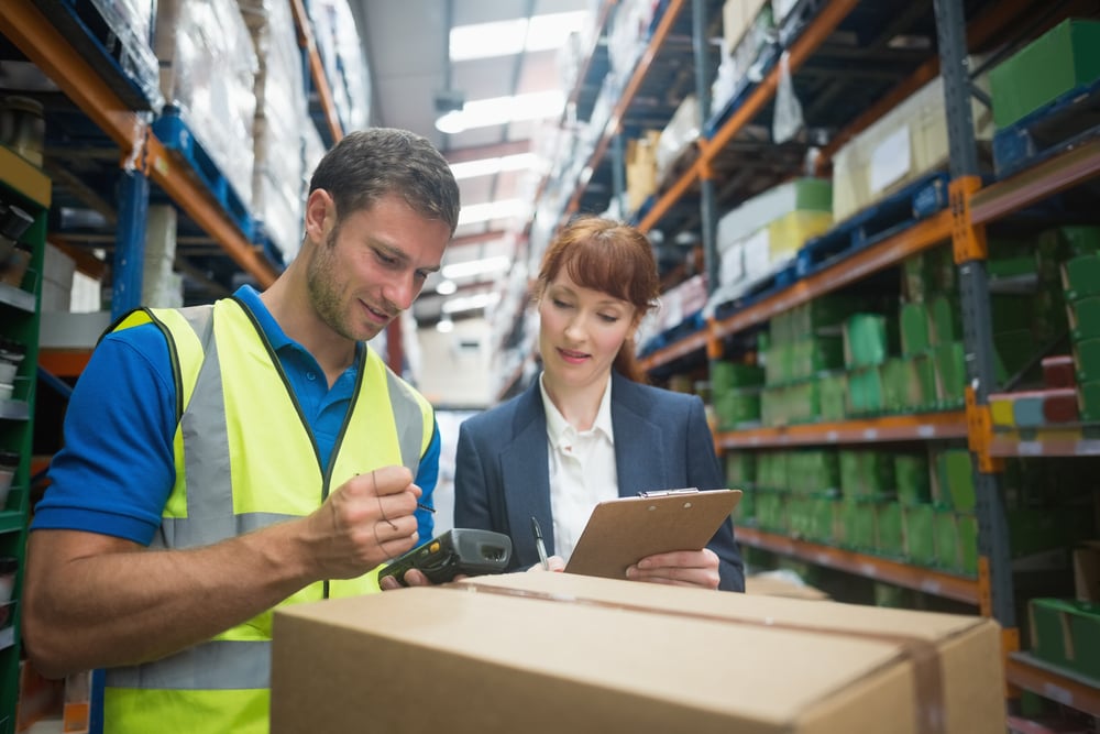 Portrait of manual worker and manager scanning package in the warehouse-1