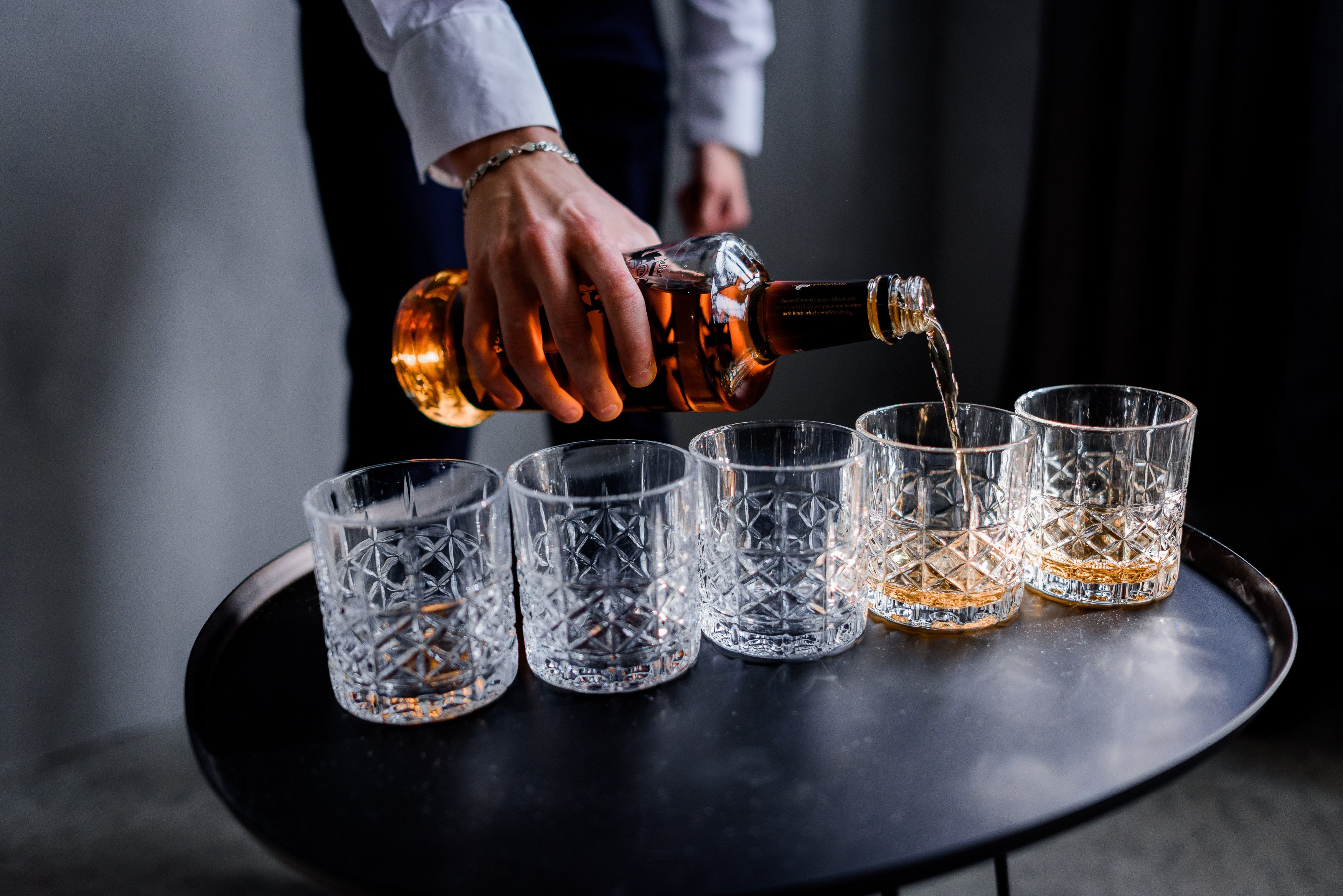 pouring diageo alcohol to the glass